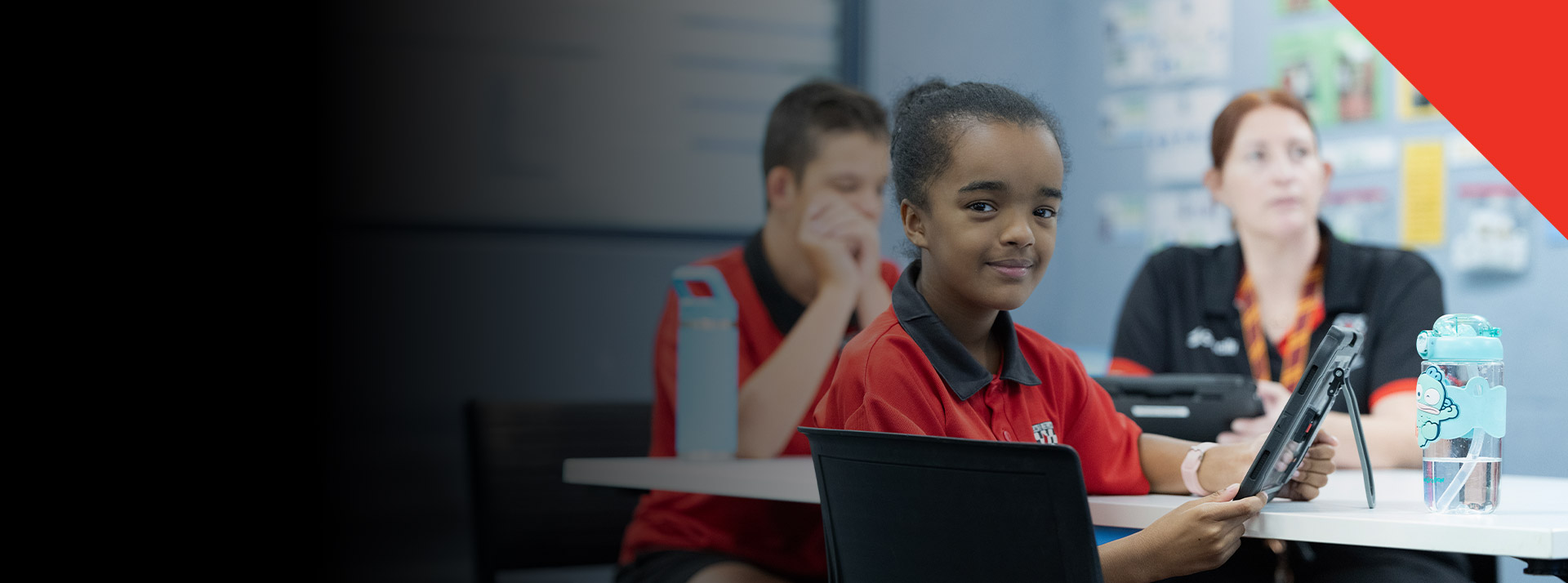 Student smiling in the classroom at Xavier College Llandilo