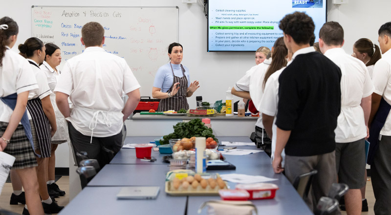 Students learning together in the commercial kitchen at Xavier College Llandilo