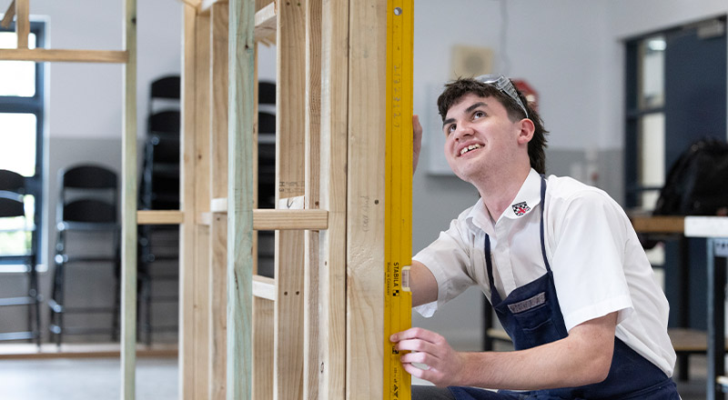 Student working on a timber frame in TAS class at Xavier College Llandilo