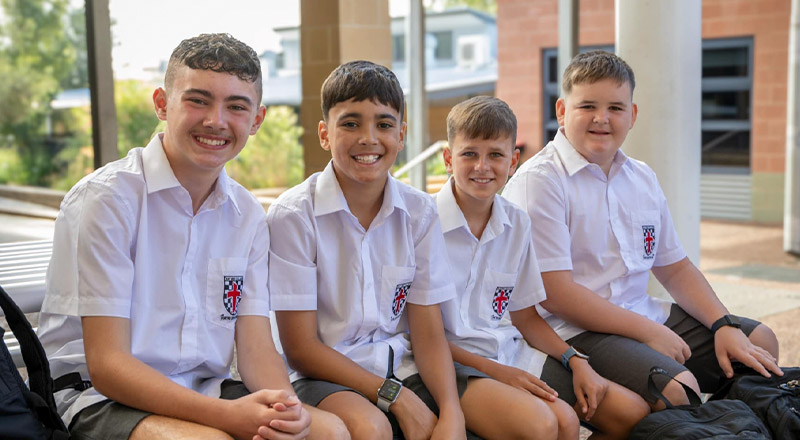 Students smiling in the playground together at Xavier College Llandilo