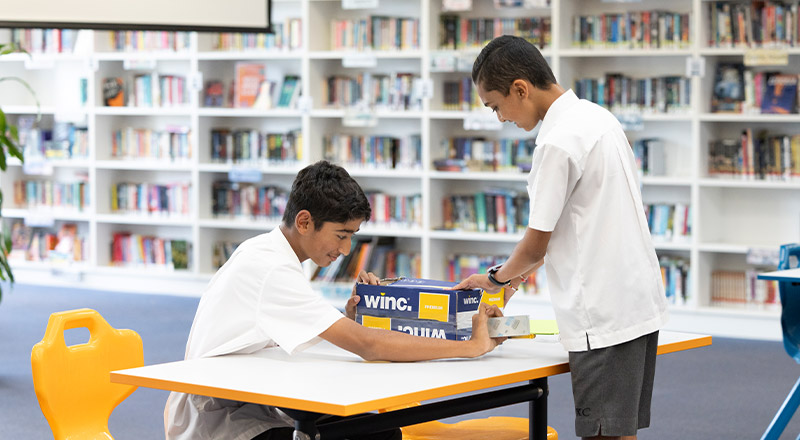 Students working on a project in the library at Xavier College Llandilo