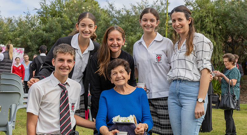 Students with their family at a school event at Xavier College Llandilo