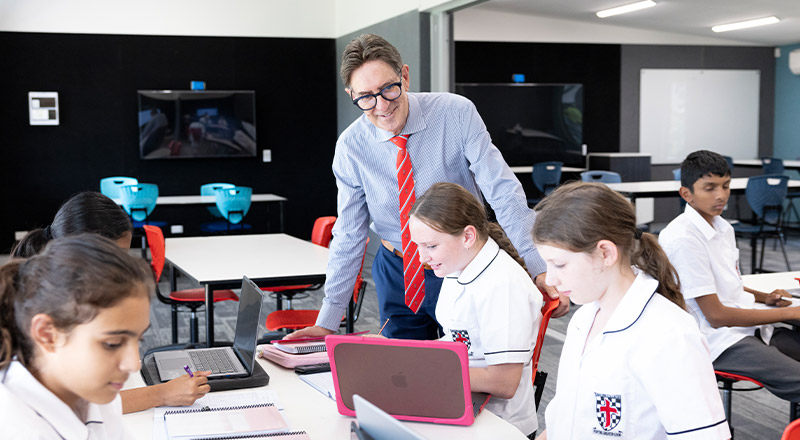 Michael Pate, the principal of Xavier College Llandilo with students in the classroom