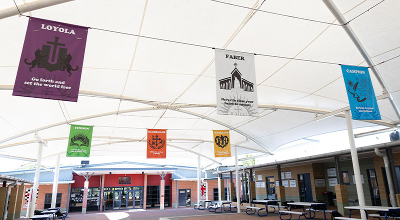 The school crests hanging in the pavilion at Xavier College Llandilo