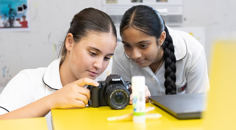 Student learning photography at Xavier College Llandilo