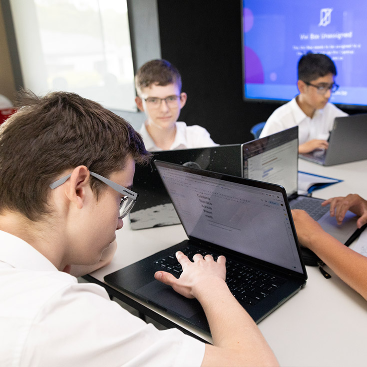 Students using their laptops in the classroom at Xavier College Llandilo