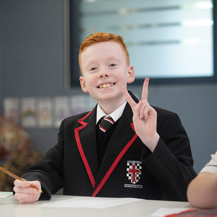 Student smiling in the Kirinari classroom at Xavier College Llandilo
