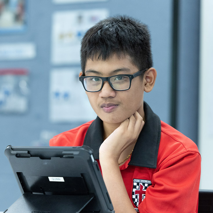 Student working in the classroom at Xavier College Llandilo