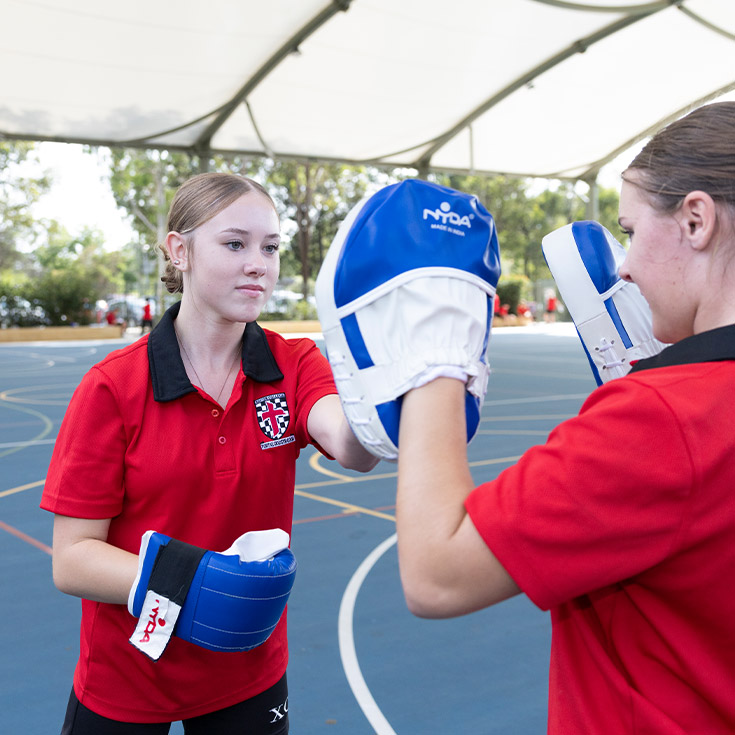 Students practising boxing during PE class at Xavier College Llandilo
