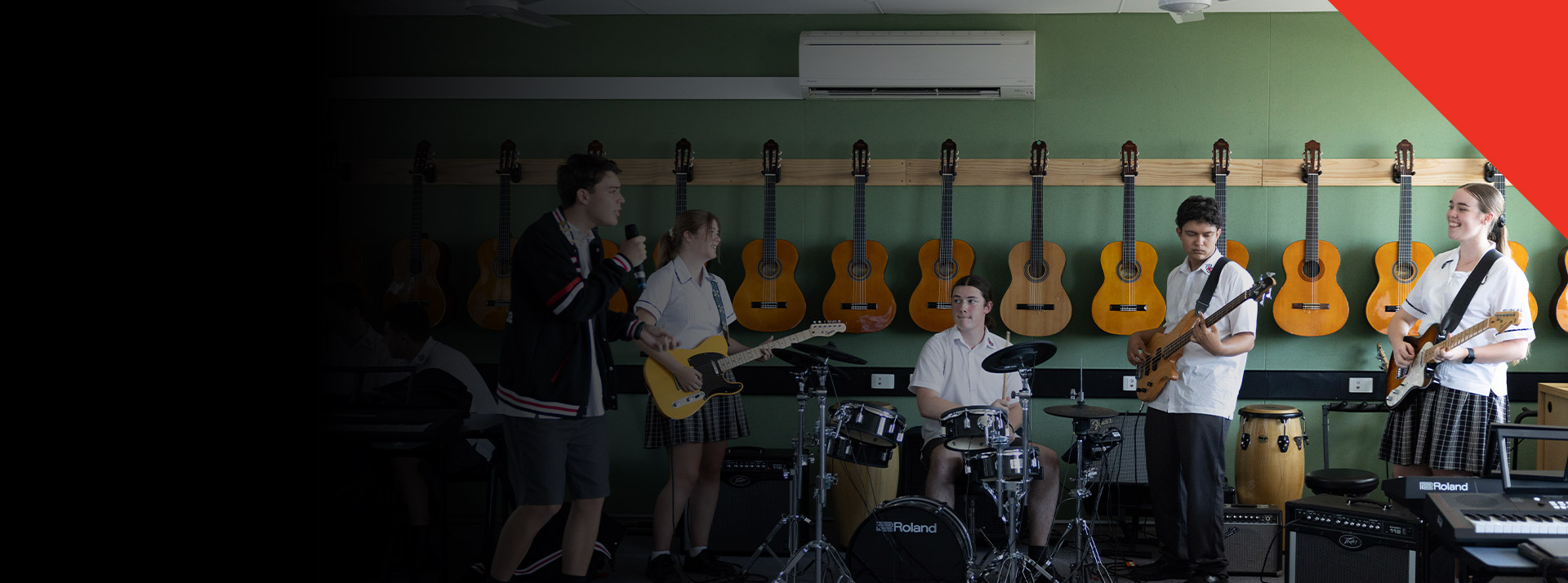 Students practising their instruments in the classroom at Xavier College Llandilo