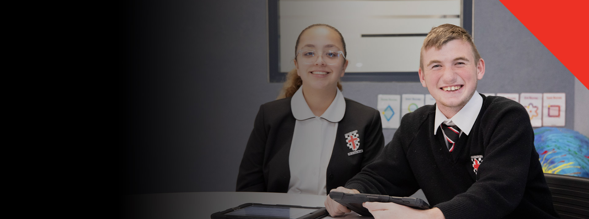 Students smiling in the classroom together at Xavier College Llandilo