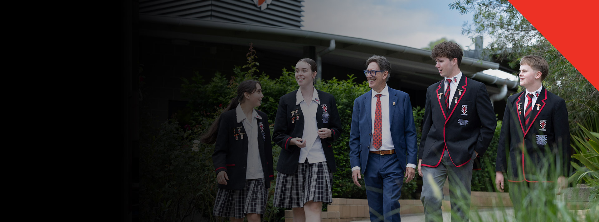 Students walking with their principal Michael Pate through the school grounds at Xavier College Llandilo