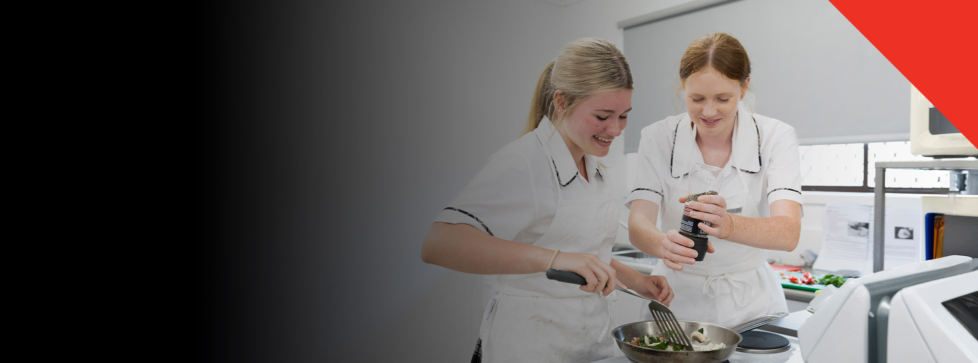Students cooking together in the commercial kitchen at Xavier College Llandilo