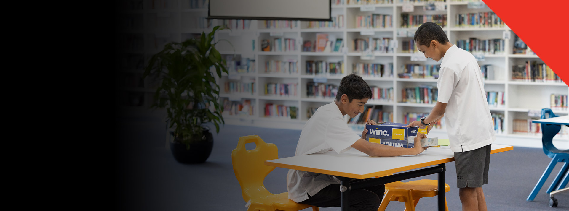 Students working on a project in the library at Xavier College Llandilo