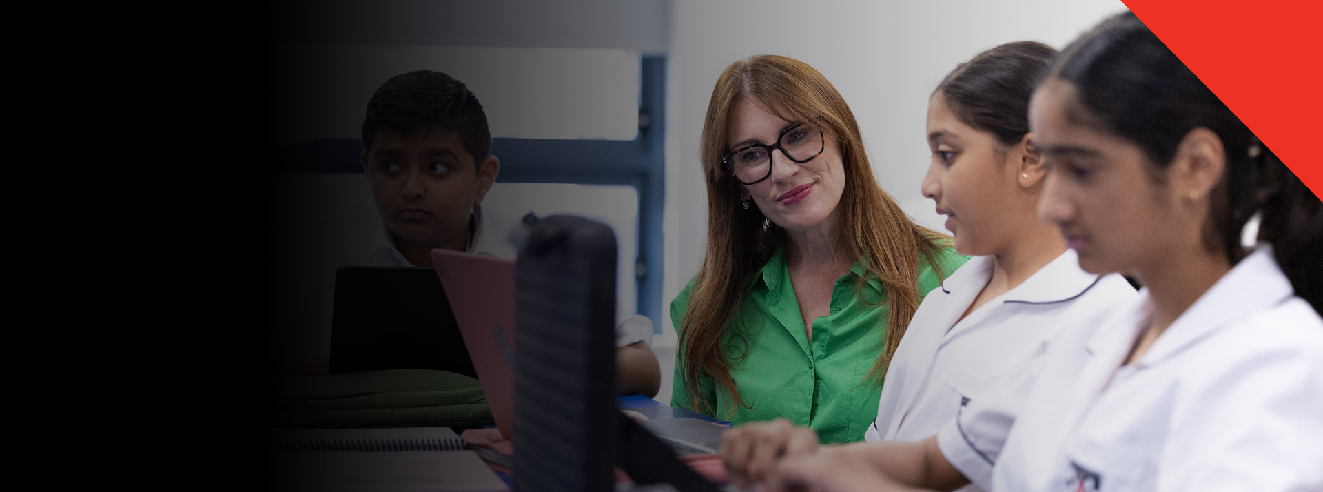 Teacher working with her students in the classroom at Xavier College Llandilo