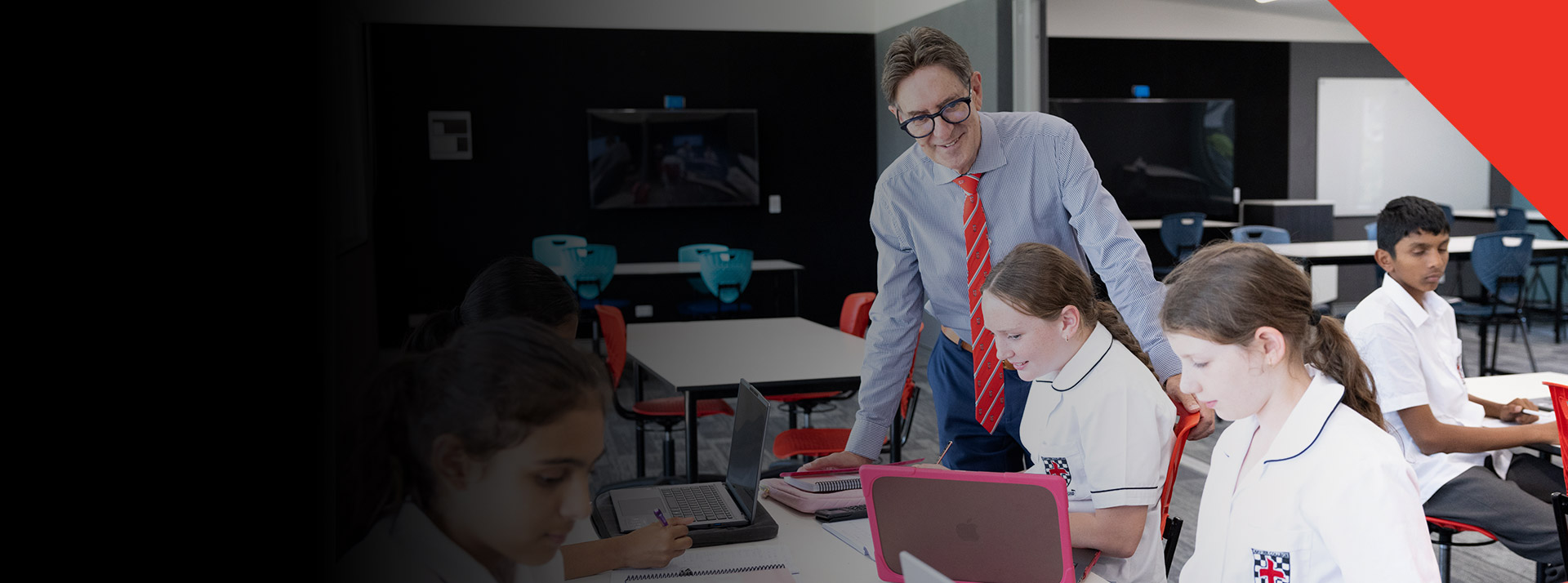 Principal of Xavier College Llandilo, Michael Pate with student sin the classroom