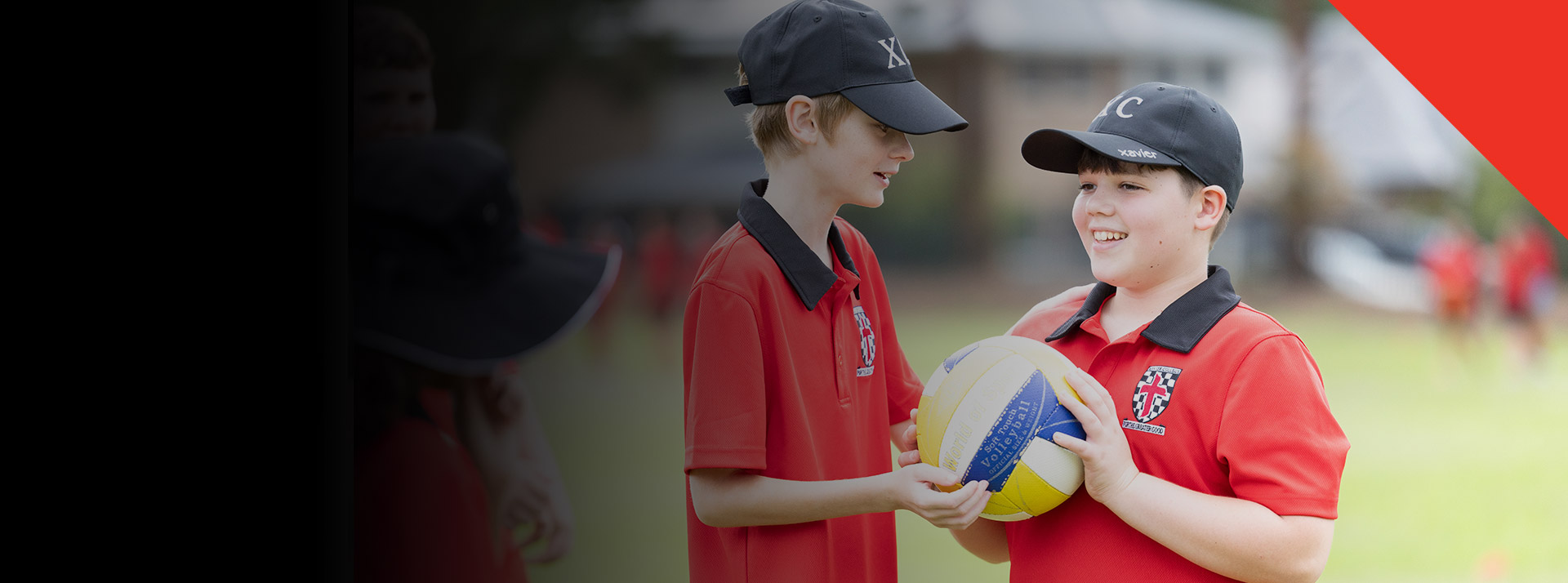 Students playing sport on the school oval at Xavier College Llandilo