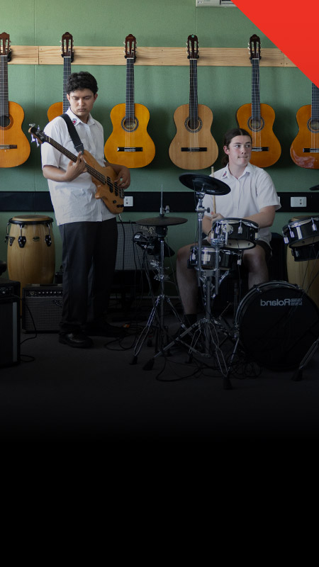 Students practising their instruments in the classroom at Xavier College Llandilo