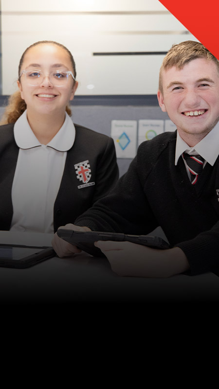 Students smiling in the classroom together at Xavier College Llandilo