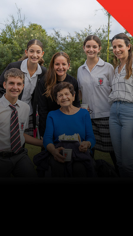 Students with their family at a school event at Xavier College Llandilo